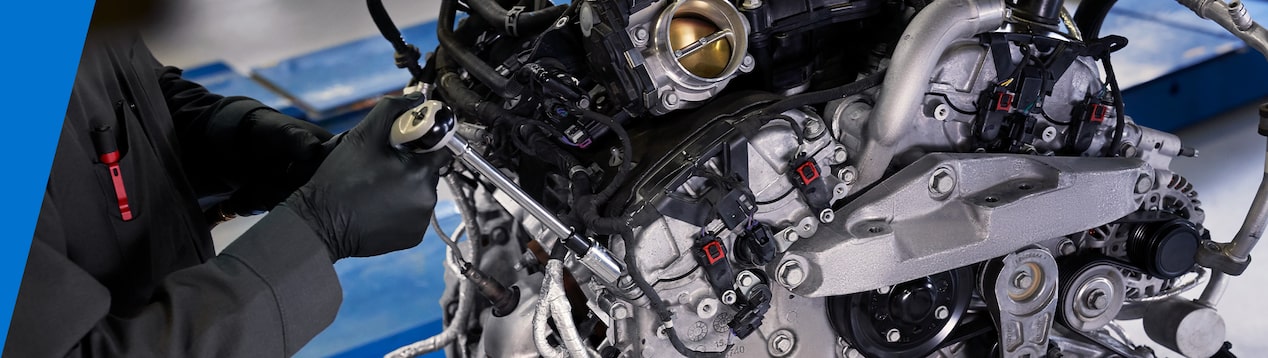 Mechanics hand on engine
