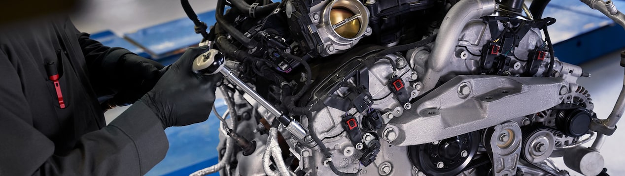 Mechanics hand on engine