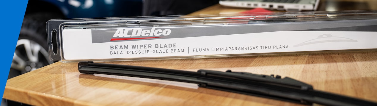 ACDelco wiper blade and packaging displayed on wooden surface